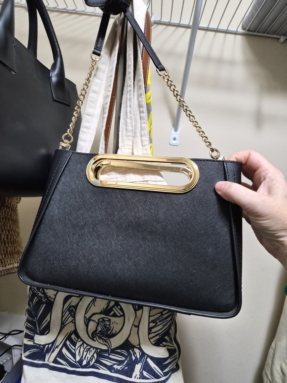 Elegant Black Chain-Handle Clutch with Gold Accent